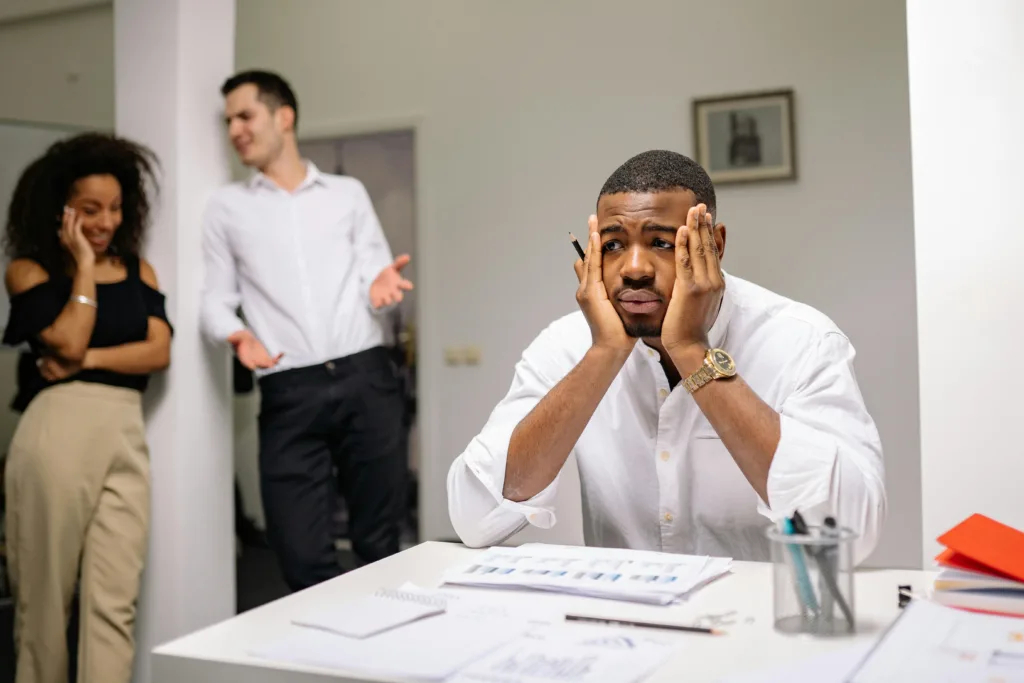 Man stressed with hands on cheeks